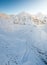 Aerial drone view of the amazing curved windy road motorway Transfagarasan in Romania during a winter morning landscape with mount