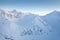 Aerial drone view of the amazing curved windy road motorway Transfagarasan in Romania during a winter morning landscape with mount