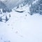 Aerial drone view of the amazing curved windy road motorway Transfagarasan in Romania during a winter morning landscape with mount