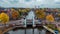 Aerial drone view Amsterdam autumn cityscape narrow old houses, canals, boats bird's eye view