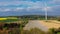 Aerial drone view of asparagus fields and yellow rapeseed fields in German countryside.