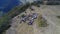 Aerial drone view of ATV quads on a dirt trail in forests. Off-road group team club enthusiasts having fun while driving