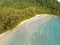 Aerial drone view of beautiful beach with turquoise sea water and palm trees of Gulf of Thailand. Kood island, Thailand.