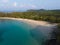 Aerial drone view of beautiful beach with turquoise sea water and palm trees of Gulf of Thailand. Kood island, Thailand.