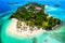 Aerial drone view of beautiful caribbean tropical island Cayo Levantado beach with palms. Bacardi Island, Dominican Republic.
