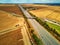 Aerial drone view of beautiful French countryside and six-lane motorway in France