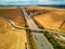 Aerial drone view of beautiful French countryside and six-lane motorway in France