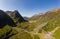 Aerial drone view of the beautiful valley of Glencoe in the Scottish highlands on a clear, sunny day