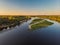 Aerial drone view. The bend of a wide river among green meadows