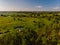 Aerial drone view. The bend of a wide river among green meadows