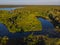 Aerial drone view. The bend of a wide river among green meadows