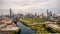 Aerial drone view of a boat sailing on the Chicago river under a bridge