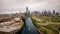 Aerial drone view of a boat sailing on the Chicago river under a bridge