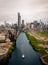 Aerial drone view of a boat sailing on the Chicago river under a bridge