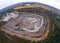 Aerial drone view of career in Europe, crushed stone quarry at summer sunset