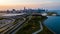 aerial drone view of Chicago metropolis from the lake during sunset