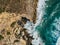 Aerial Drone View Of Dramatic Ocean Waves On Rocky Landscape