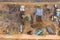 Aerial drone view of excavator loading the tipper truck at the construction site