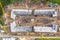 Aerial drone view of excavator loading the tipper truck at the construction site