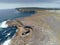 Aerial drone view on famous Poll na bPÃ©ist - The Wormhole, Inishmore, Aran islands, county Galway, Ireland. Popular tourist hike
