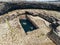 Aerial drone view on famous Poll na bPÃ©ist - The Wormhole, Inishmore, Aran islands, county Galway, Ireland. Popular tourist hike