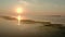 Aerial drone view of Fisherman on the boat on the sunrise, morning fishing, swimming on a calm lake in dawn misty. foggy
