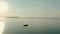 Aerial drone view of Fisherman on the boat on the sunrise, morning fishing, swimming on a calm lake in dawn V2