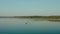 Aerial drone view of Fisherman on the boat on the sunrise, morning fishing, swimming on a calm lake in dawn V5
