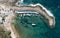 Aerial drone view of fishing boats moored at the harbor. moored at breakwater.