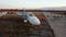 Aerial drone view flight over parking lot of old dismantled aircraft. Cemetery