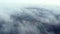 Aerial drone view flight over white clouds of mist, artificially created lakes