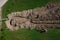 Aerial drone view of geothermal heating collector pit or trench in the ground. Excavation of ditch or holes for thermal heat