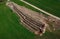 Aerial drone view of geothermal heating collector pit or trench in the ground. Excavation of ditch or holes for thermal heat