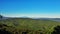 Aerial drone view of green mountains of Serbia under a blue sky