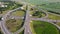 Aerial drone view of highway multi-level junction road with moving cars