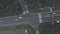 Aerial drone view of highway road with moving cars. Modern speedy highway with road markings, top view. Crossroad with moving cars