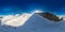 An aerial drone view of the Hintertux Glacier. Ski slops on the top of the Hintertux glacier in the Austrian Alps. 360 panorama