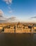 Aerial drone view of Hungarian Parliament facade by danube river in Budapest sunset hour