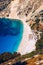 Aerial drone view of iconic turquoise and sapphire bay and beach of Myrtos, Kefalonia (Cephalonia) island, Ionian, Greece. Myrtos