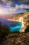 Aerial drone view of iconic turquoise and sapphire bay and beach of Myrtos, Kefalonia (Cephalonia) island, Ionian, Greece. Myrtos