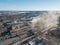 Aerial drone view of industrial area of refractory plant. Fuming pipes of factory. Industrial air pollution concept