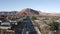 Aerial Drone view of Ivins St George in Utah on a bright sunny winter day showing city in front of red mountains and red cliff nat