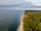 Aerial drone view of Karkle, Lithuania baltic sea beach coast line near famous tourist attraction spot The Dutchman`s Cap