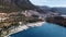 Aerial drone view of Kas town in Turkey located on the shoreline next to the harbor bay