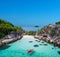 Aerial drone view of in kayak in crystal clear lagoon sea water during summer day near Koh Lipe island in Thailand.