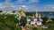 Aerial drone view of Kiev Pechersk Lavra churches on hills from above, cityscape of Kyiv city, Ukraine