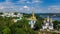 Aerial drone view of Kiev Pechersk Lavra churches on hills from above, cityscape of Kyiv city, Ukraine