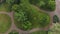 Aerial drone view of landscape automatic garden watering system with different sprinklers installed under turf