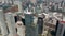 Aerial drone view of large cityscape. Camera tilting down to detail of modern tall Paradox Torre building. Mexico city