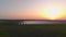 Aerial drone view into large solar panels at a solar farm at summer sunset. Solar cell power plants. footage video 4k.